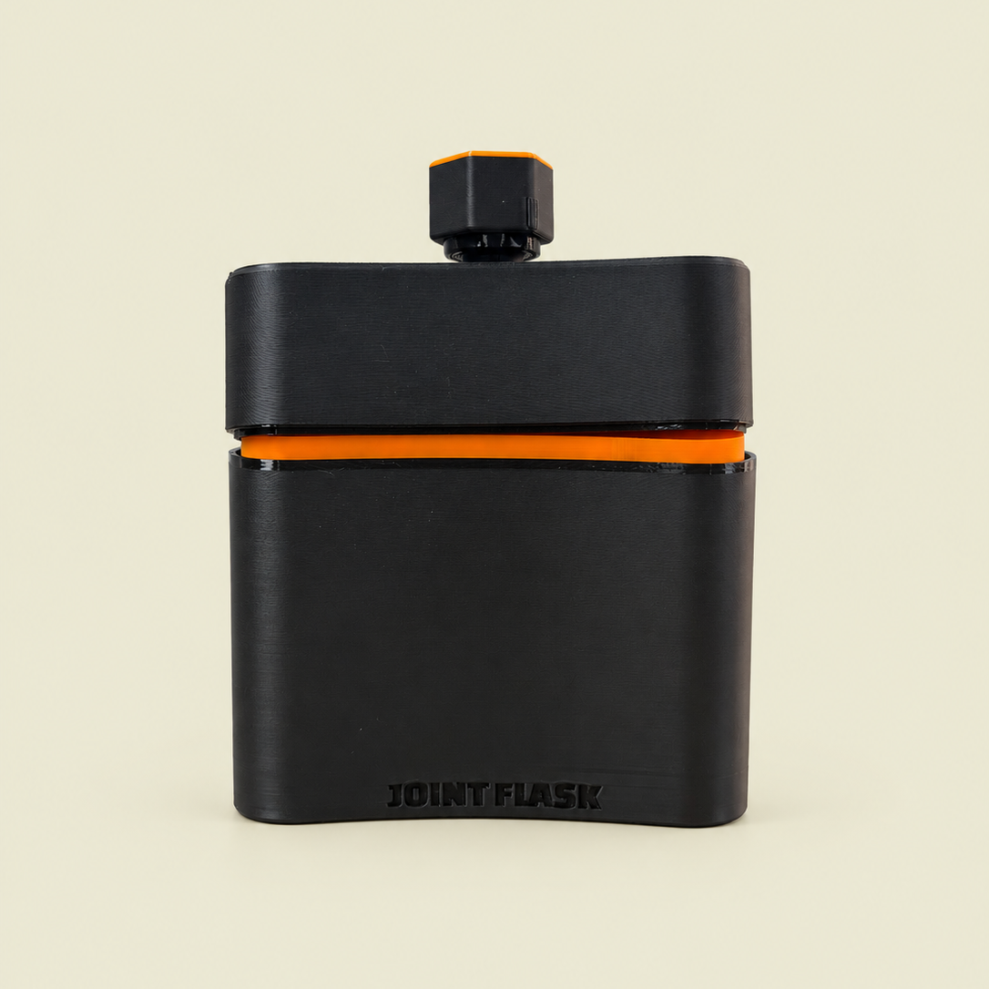 A matte black travel flask with a bright orange accent band and matching orange details on the cap, shown on a solid light beige background. The brand name 'JOINT FLASK' is embossed on the front.