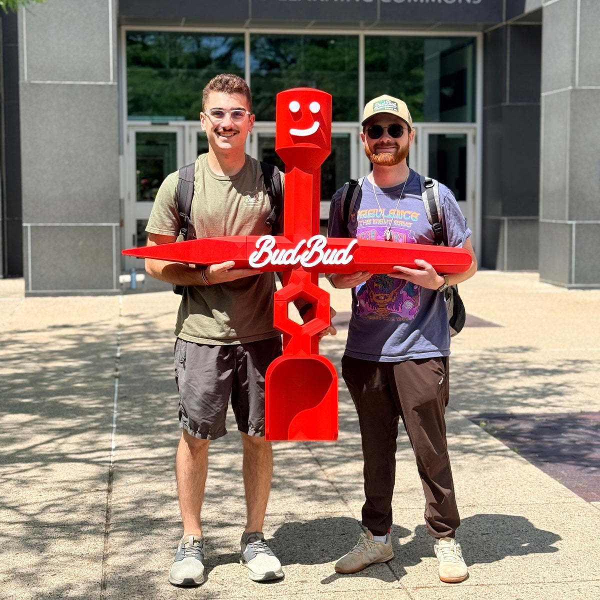 The BudBud founders holding a BudBud tool